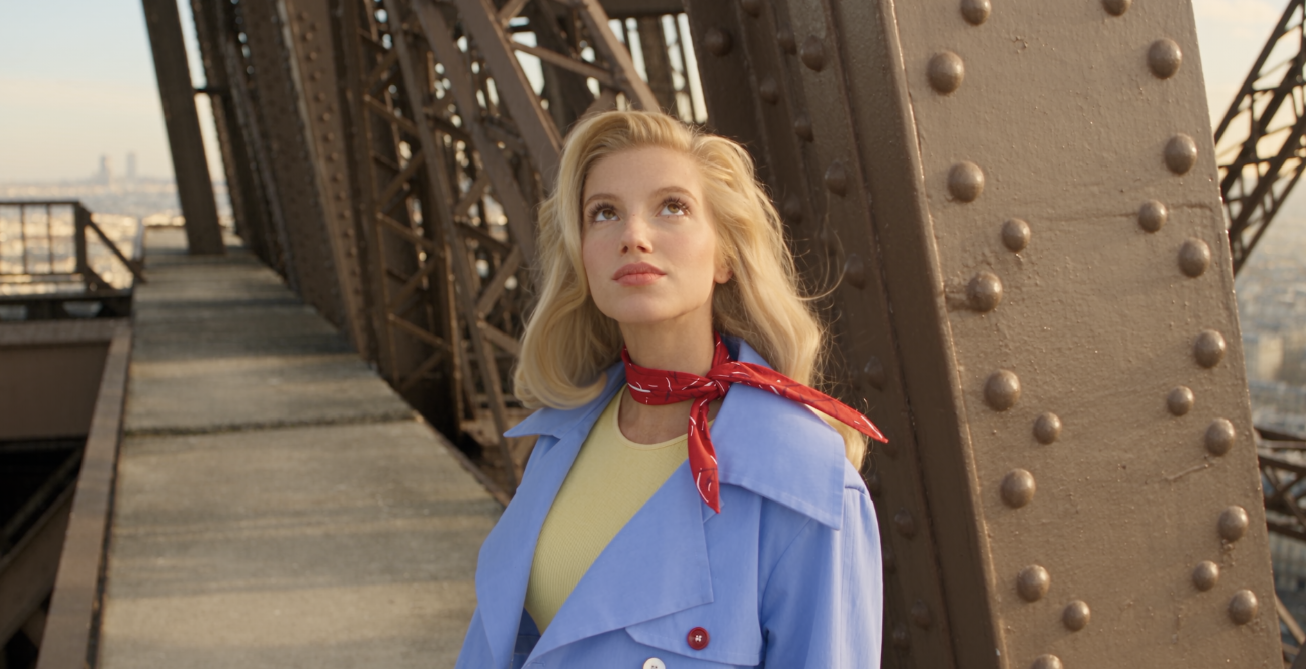 Emma at the Eiffel Tower in sky blue with a red scarf